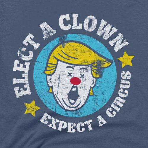 Close-up dark blue T-shirt graphic: clown face circle, “Elect a Clown” and stars
