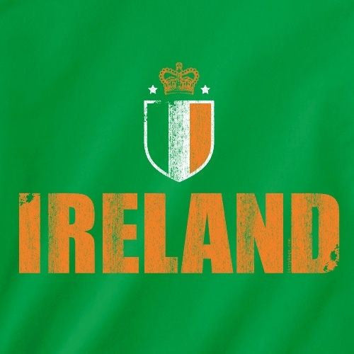 Green tee front close-up: Ireland letters and shield crest graphic